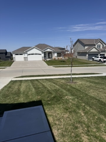 Ranch home front yard with professional lawn striping